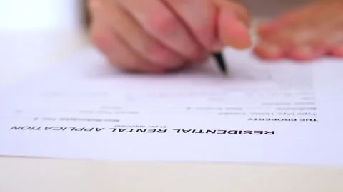 Young man enters data in the residential rental application - work abroa Stock Footage 240327700