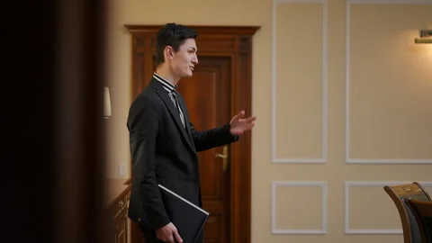 A Young Man Enters a Professional Setting, Signifying His Ambition, Focus Stock Footage 291551529