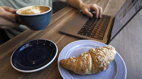 Young Man Enthusiastically Working Within a Cozy Cafe Environment, close-up Stock Footage 281106622