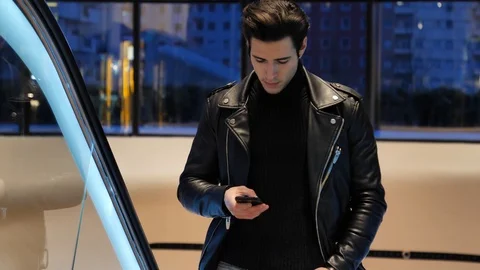 Young man on escalator in shopping mall Stock Footage 88055189