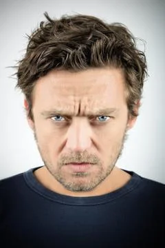 Young man with an evil expression Stock Photos