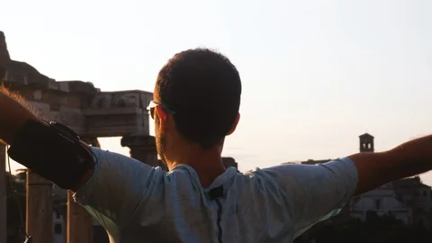 Young man exercising in front of the Roman Forum at sunrise. Historical imperial Video stock 115852177