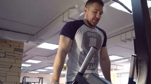 Young man exercising in the gym, exercise triceps Stock Footage 85954091