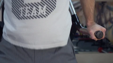 Young man exercising in the gym, exercise triceps Vídeo Stock 85954127