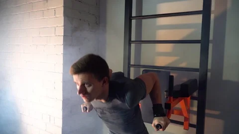 Young man exercising in the gym, exercise triceps Stock Footage 86078741