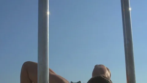 Young man exercising on horizontal bar outdoors. fitness, sport concept Video stock 84041609