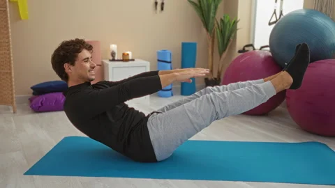 Young man exercising indoors, Stock Video Pond5