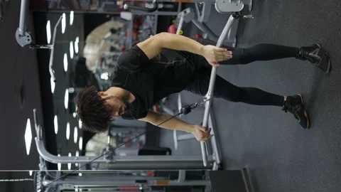 Young man exercising on lateral pull at gym for the back mucles 스톡 동영상 196922744