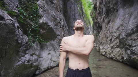 Young man exercising in nature. Stock Footage 212430678