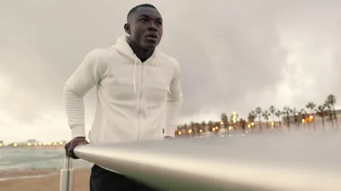 Young man exercising on parallel bars outdoors Stock-Footage 280347440