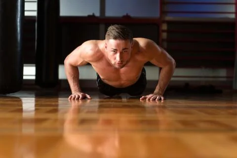 Young Man Exercising Push Ups Stock Photos