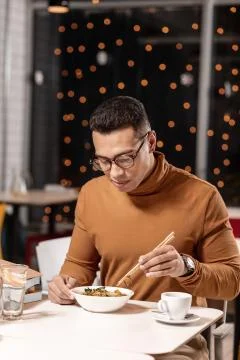 Young man expecting something different form ordered meal. Stock Photos