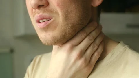 Young man experiencing severe sore throat pain Stock Footage 337828139