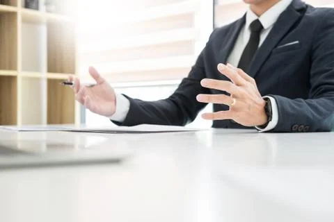 Young man explaining about his profile to business managers sitting in job In Stock Photos