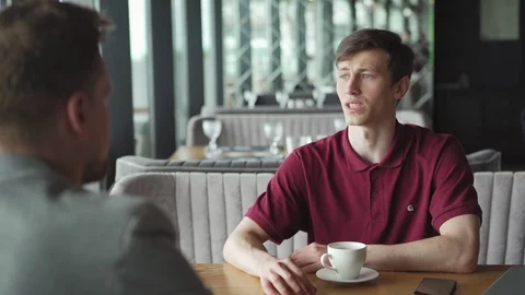 Young man explaining business proposal to partner Stock Footage 111755793