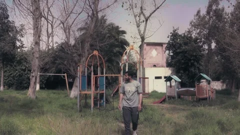 Young Man Exploring Abandoned Overgrown Playground Benslimane Видео 340400638
