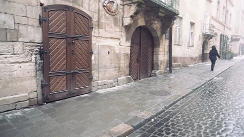 Young man exploring map while standing near old building. Stock Footage 86157291