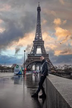 Young man exploring Paris and Eiffel tower in France. Stock Photos