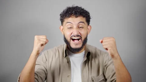 Young man expressing different emotions on white background Stock Footage 314785565