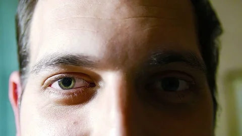 Young man eye smiling and looking at camera Stock Footage 71394185