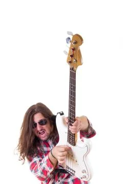 Young man with face expression playing electric bass guitar Stock Photos