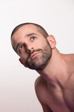 Young man face head looking above up Stock Photos