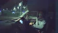 The young man with a face mask driving in the car on the night city road 4k or 4k+ Resolution