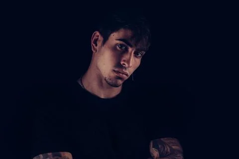 Young man facing the camera with arms crossed Stock Photos