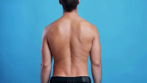 Young man Feeling suffering Lower back pain Pain relief concept Painful spine 動画素材 336585202