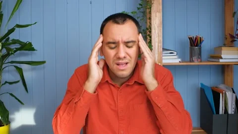 Young man feels pressure of work or education, stops and closes laptop and takes Stock Footage 148237667