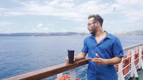 The young man is on the ferry. In slow motion. Stock Footage 212541369