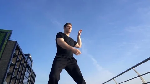 Young man fight training against sunrise in slow motion Stock Footage 77724559