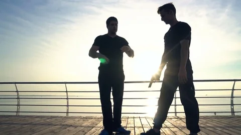 Young man fight training against sunrise in slow motion Stock Footage 79174084