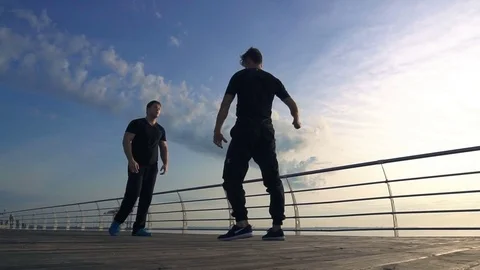 Young man fight training against sunrise in slow motion Stock Footage 79175908