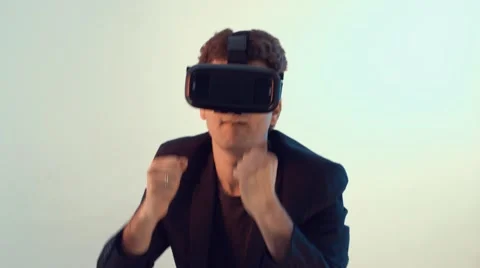 Young man fights in virtual reality game Stock Footage 63188261