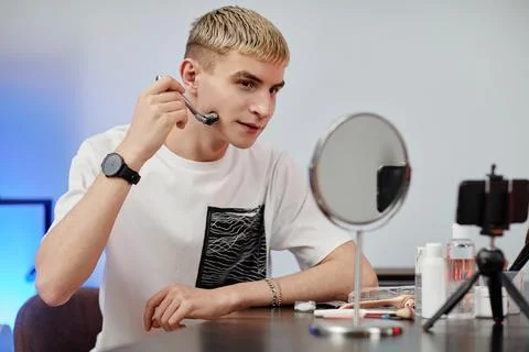 Young Man Filming Beauty Tutorial 스톡 사진