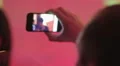 Young man filming performance of popular DJ on smartphone, party in night club HD Footage