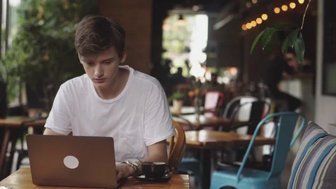 Young man finish work, freelancer and blogger working as a graphic designer 스톡 동영상 112548470