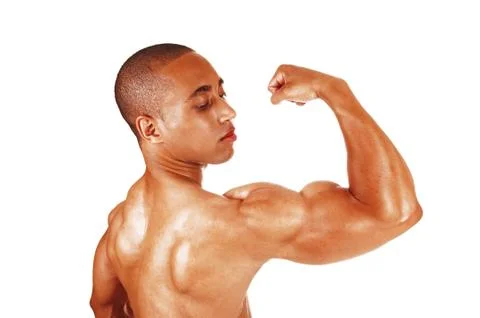 Young man flexing his biceps in close up Stock Photos