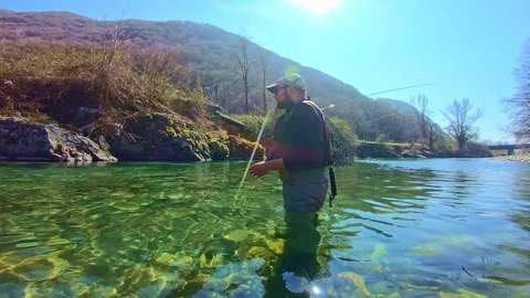 Young man flyfishing after work Video stock 107100439