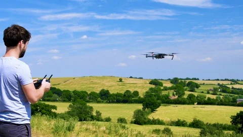 Young man flying a drone Stock Footage 91943857