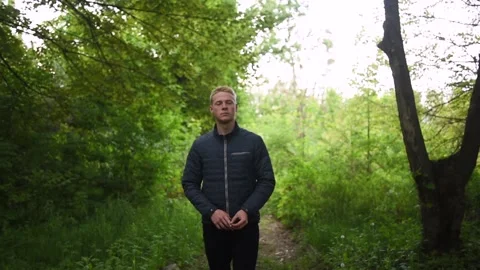 Young man in the forest Stock Footage 131339553