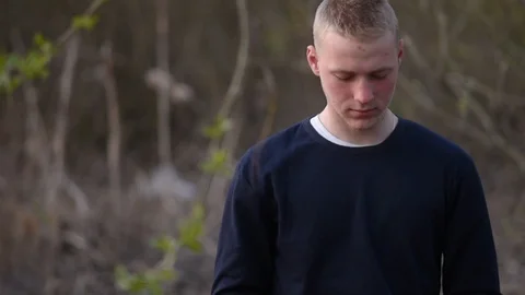 Young man in the forest working on laptop Stock Footage 128970430