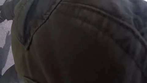 Young Man Forgot to Switch off his GoPro Camera. Going with Hiden Camera in Park Stock-Footage 82842994
