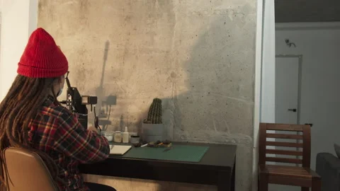 Young man freelancer designer working in office. People wear protective face Stock Footage 141605367