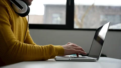 Young man freelancer entrepreneur using laptop online working from home Video stock 229778121