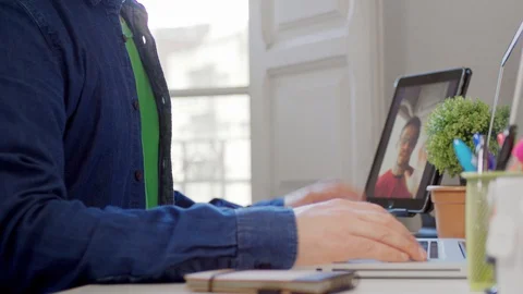 Young man freelancer having a video chat zoom meeting using a 5G WiFi Stockbeeldmateriaal 129815822