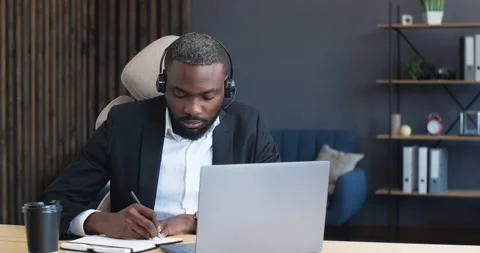Young Man Freelancer or Student using Laptop, studying online, working from home Stock Footage 142223600