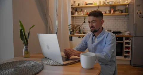 Young man freelancer student using laptop studying online working from home in Stock Footage 157651285