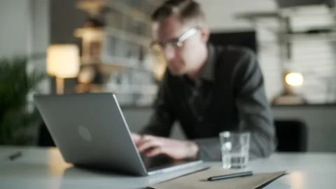 Young Man Freelancer Using Laptop Online Working From Office In Internet Stock Footage 132869039